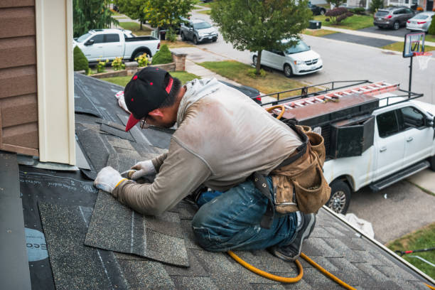 Professional Roofing technician working in Bloomingdale, IL